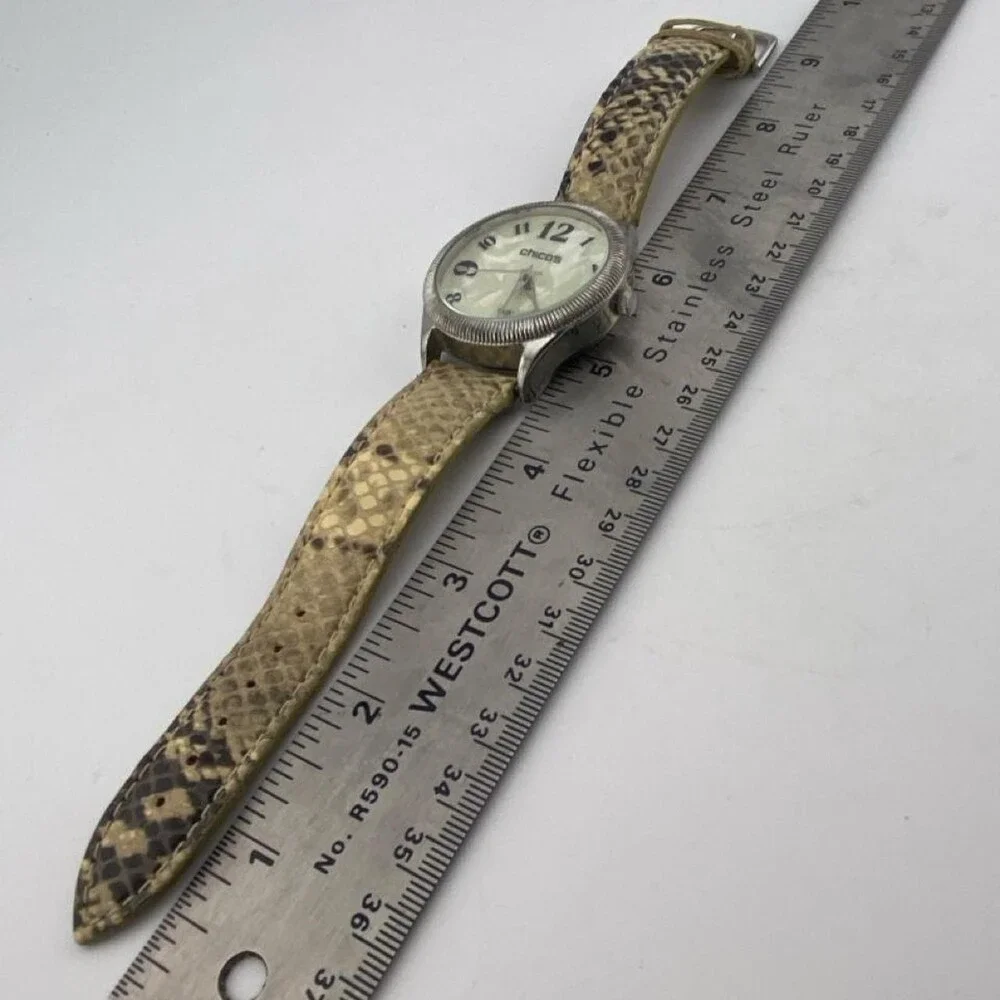 CHICO’S Women's Quartz Watch with Beige Snake-Print Leather Strap. It has a styl